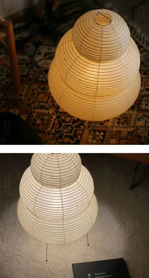Rijstpapierlamp met vier slanke zwarte metalen pootjes, 60 cm hoog en 40 cm breed, die warm licht verspreidt en past bij Japandi en Wabi Sabi interieurstijl.